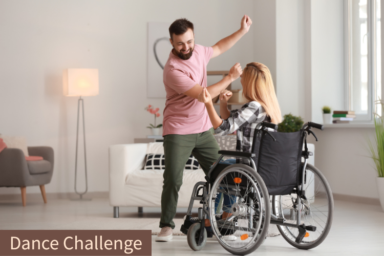 Two people, one in a wheelchair, are dancing in their livingroom