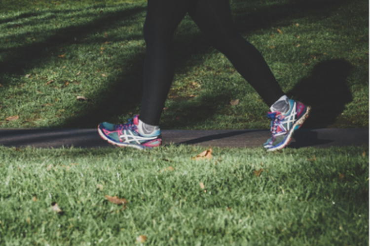 Person's legs in trainers and running leggings on a jog