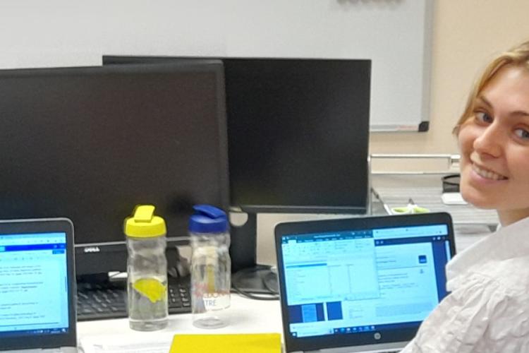 Two University of Edinubrgh Employ.Ed Interns sitting at their laptops