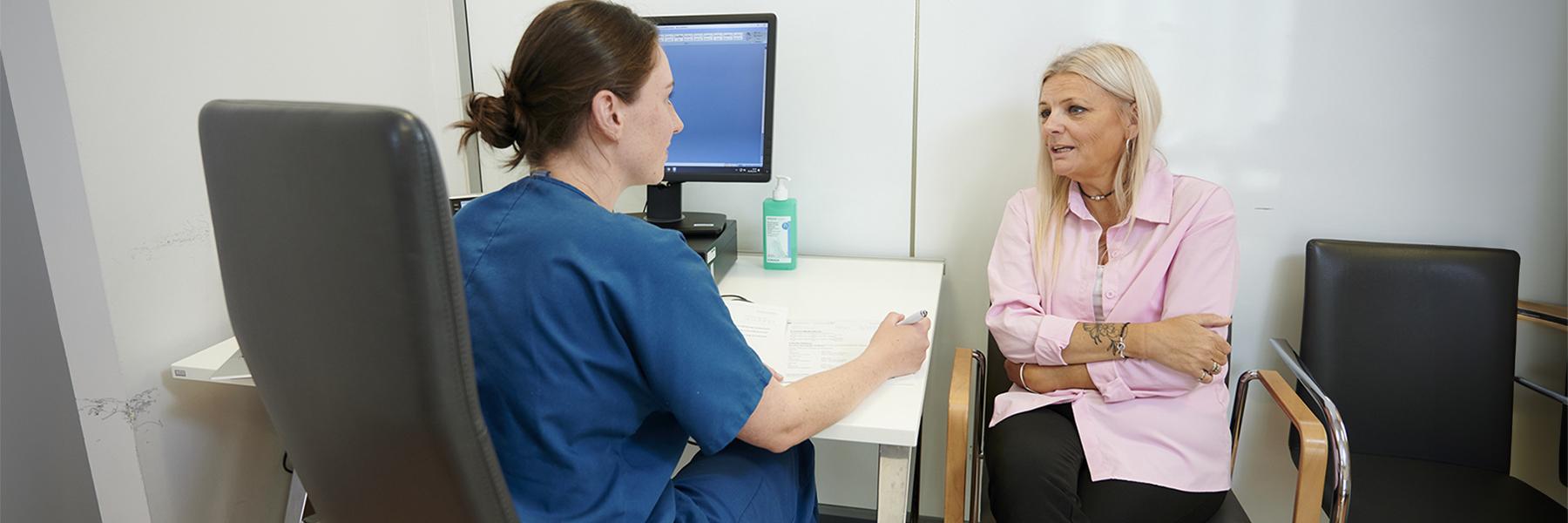 A research participant talking with a researcher and sharing their story.