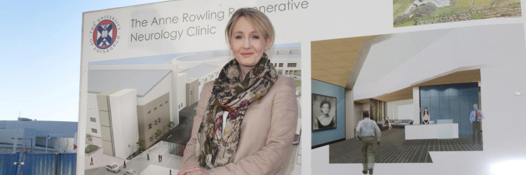 J.K Rowling pictured in-front of the Anne Rowling Clinic banner