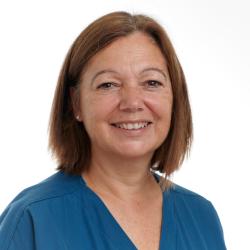 A profile picture of Dawn Lyle, smiling, wearing scrubs