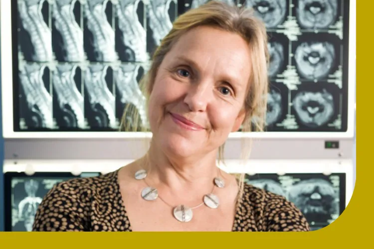 A picture of Dr Belinda Weller with MRI scan images behind her