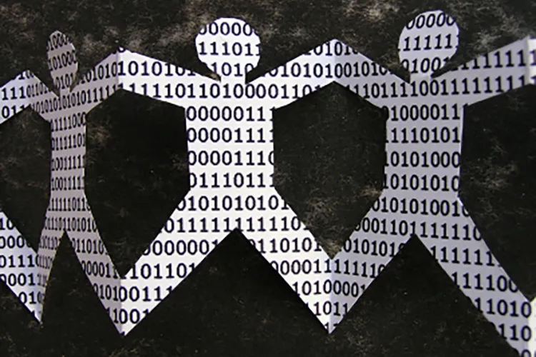 A paper chain of cut out figures, with each figure filled with binary code